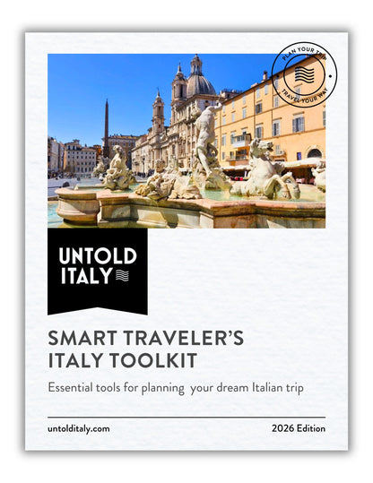 Cover of 'Smart Traveler's Italy Toolkit' by Untold Italy with a fountain and building in the background.