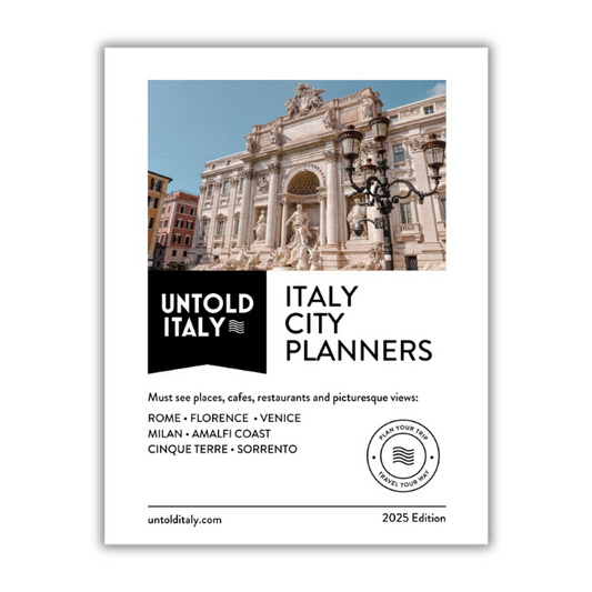 Cover of 'Untold Italy' city planners with a scenic Italian building on a white background